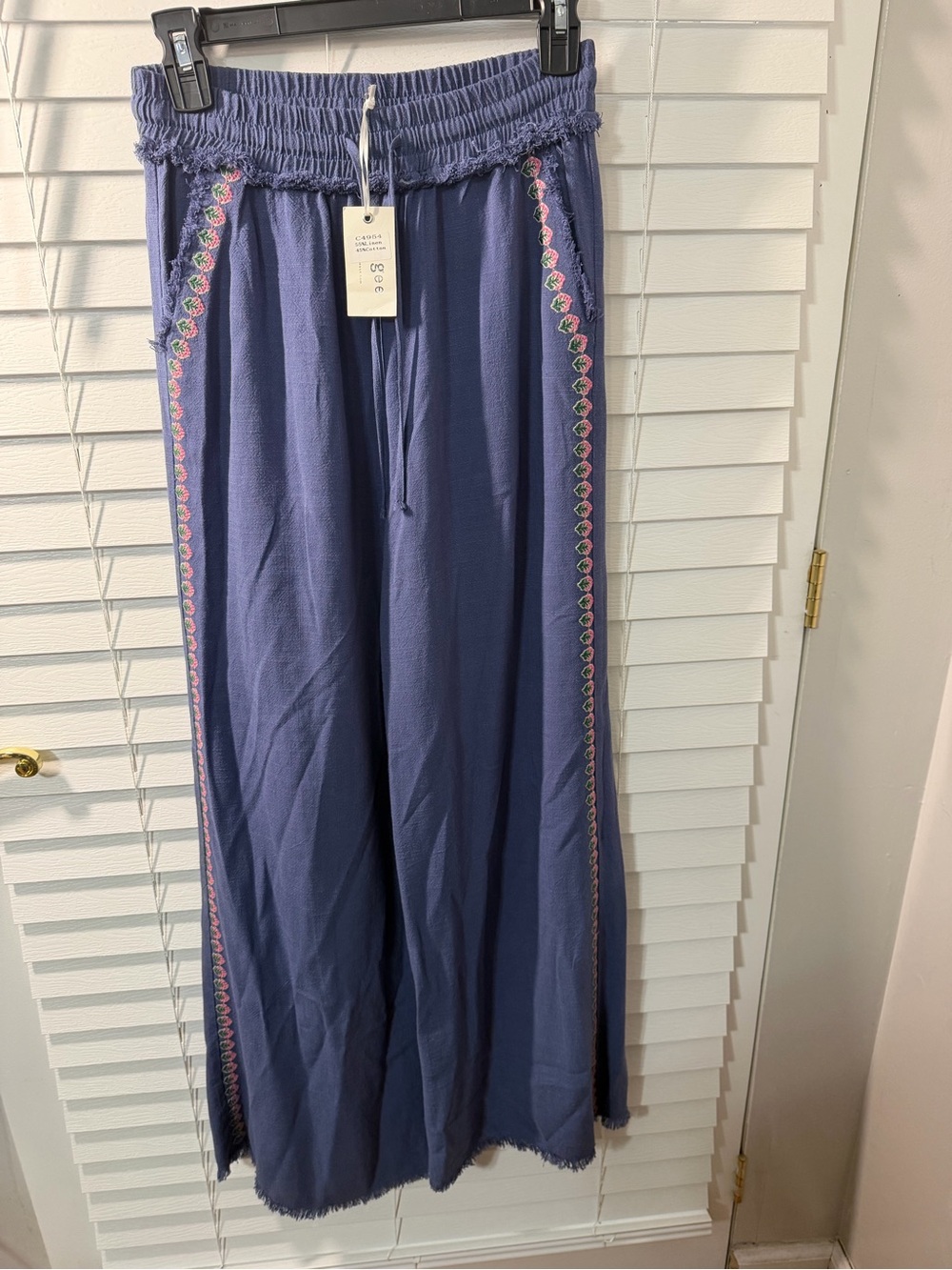 Umgee Navy Blue Garment with Ivory Brand Tag